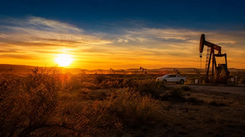 Pumpjacks on flat desert ground at sunset, How to Start an Oilfield Services Business in New Mexico